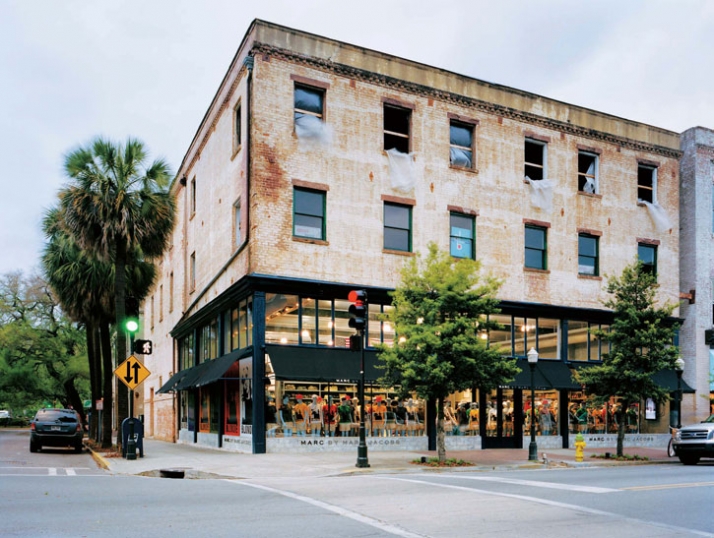 Exterior view. Inserted into an old warehouse, the store engages the street 