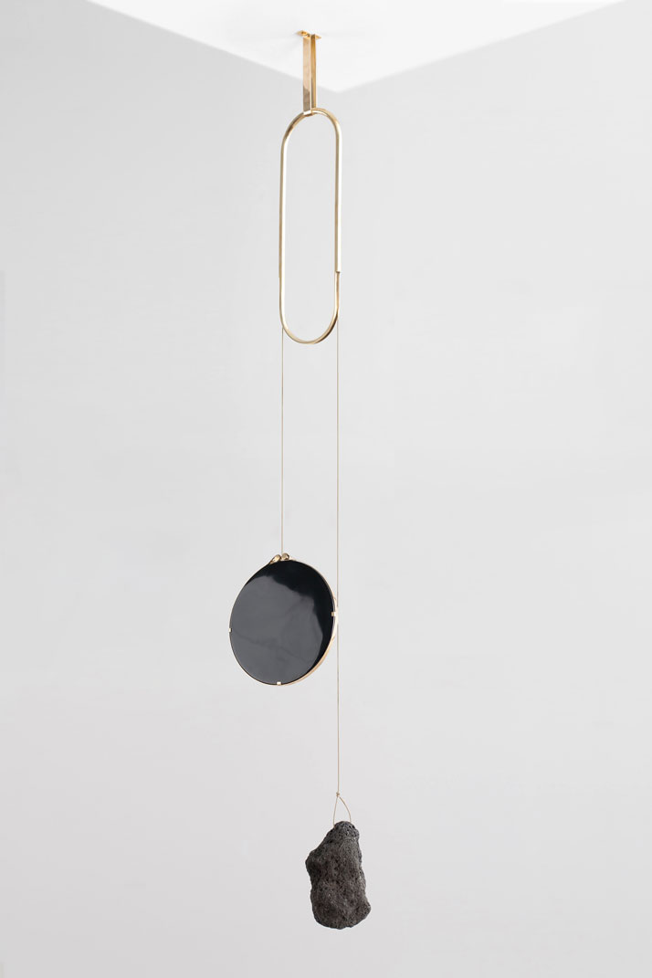 Iddu, 2014Obsidian mirror, lava rock, brass.H150 x W40 cm‘De Natura Fossilium’ by studio Formafantasma.Photo by Luisa Zanzani. Courtesy of Gallery Libby Sellers.