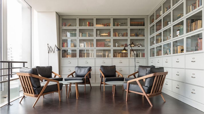 Custom designed built-in shelving to display books and historical knick-knacks.photo © Christian Köster, Aerogram studio.