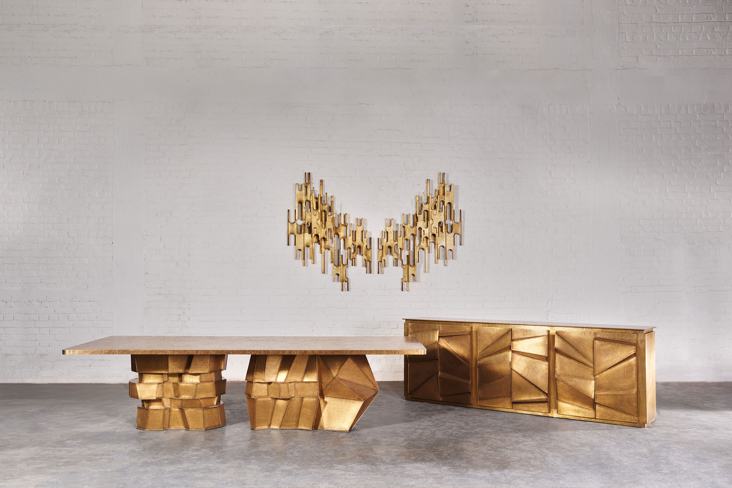 Sparkling Colosseum Lightpiece. Brass. 1067 x 1524 mm each.
Metallic Graphite Dining Table. Brass. 3048 x 1067 mm.
Metallic Graphite Cabinet. Brass. 2591 x 457 x 914 mm.
Image courtesy of Vikram Goyal.