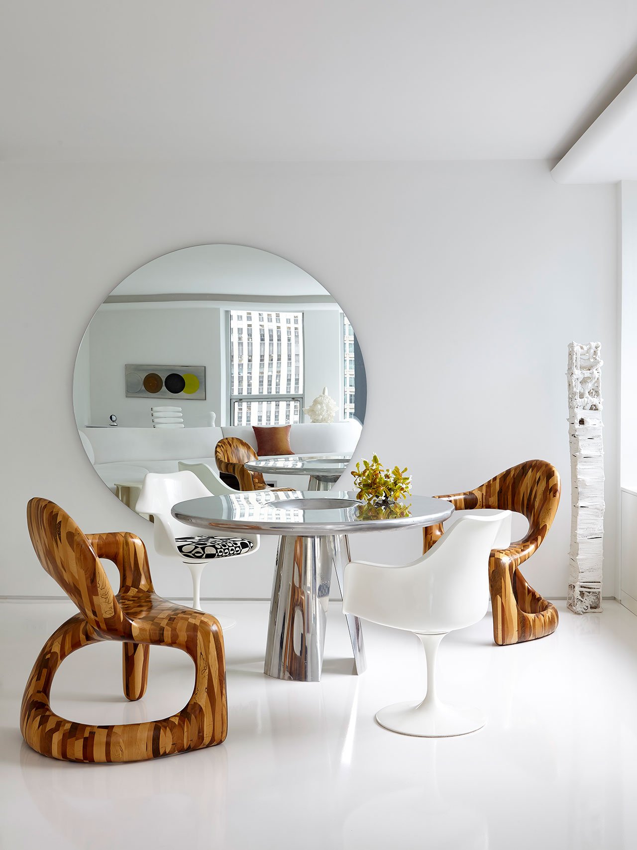 “Vortex” dining table by Mattia Bonetti via Bernd Goeckler; “Corsican” woosen chairs by Ian Spencer and Cairn Young of Yard Sale Project via Todd Merrill; Vintage Eero Saarinen Tulip Chairs from Maharam; Mirror custom-designed by Hines Collective; Sculpture: Untitled by Jin Soo Kim via Maison Gerard.
Photography by Joshua McHugh.