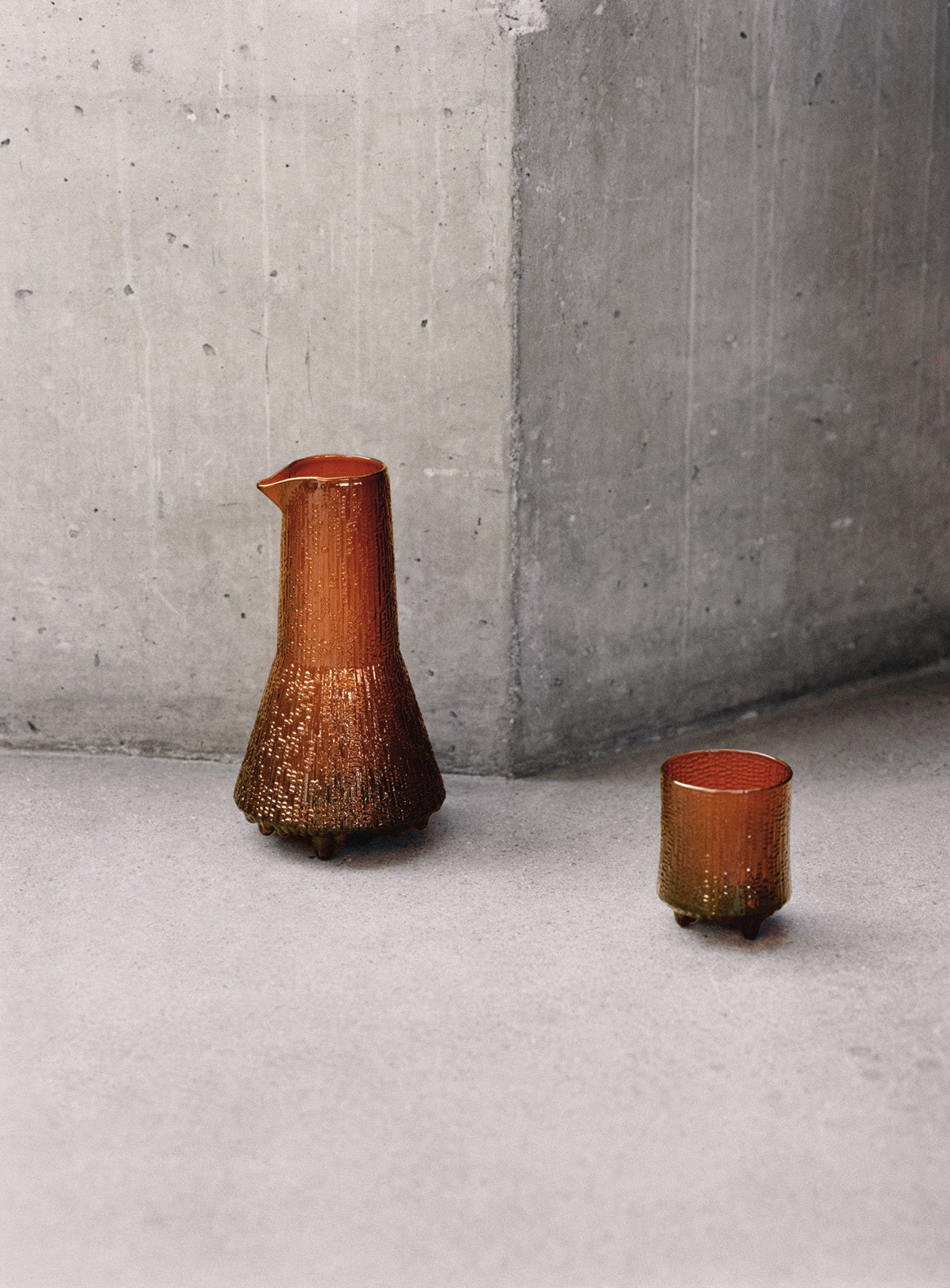 Iittala, Kaamos Collection.
Ultima Thule Pitcher &amp; Old Fashioned glass in copper designed by Tapio Wirkkala.