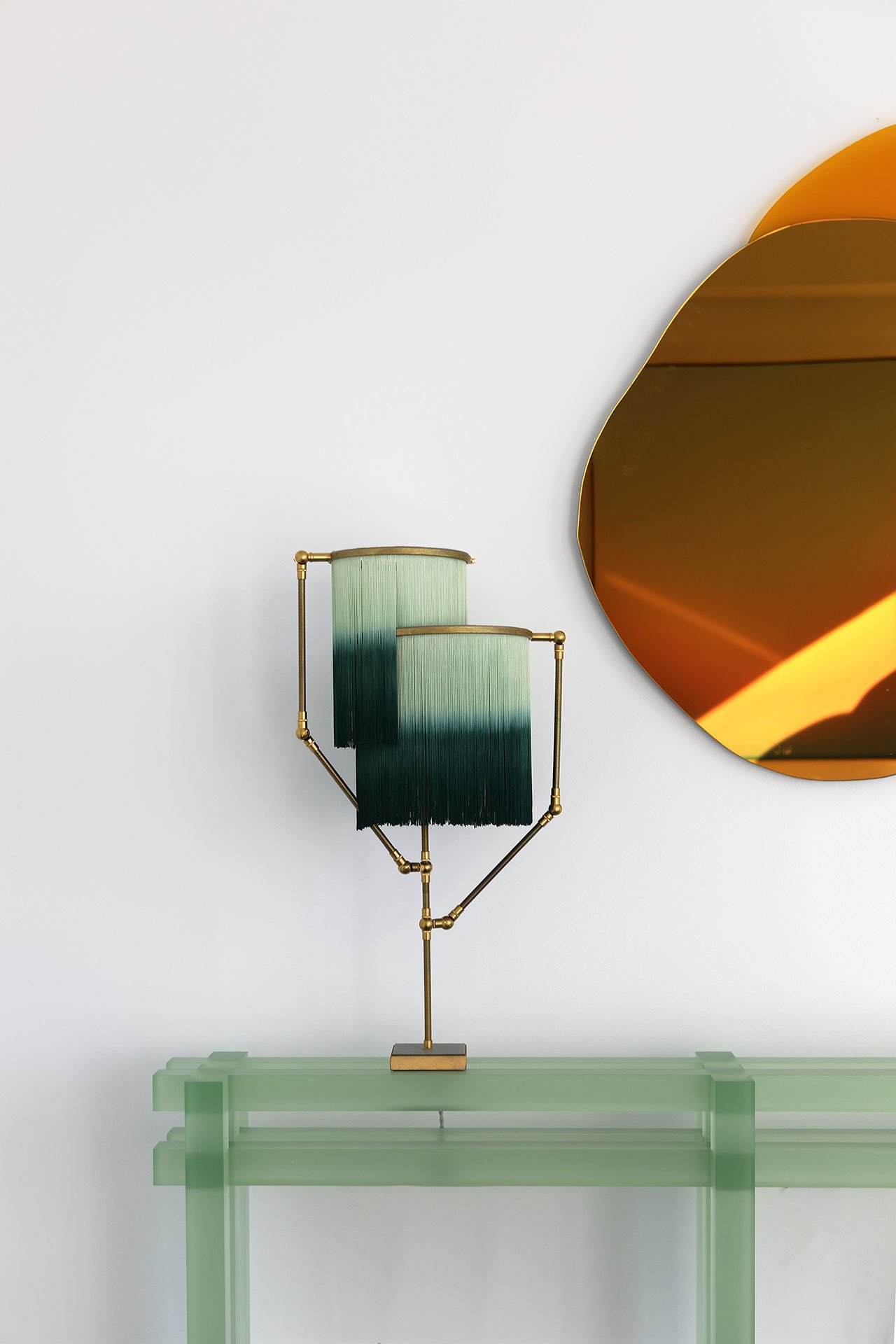 Galerie Philia at Walker Tower, Chelsea, New York. Courtesy of Galerie Philia.
Featured: 
Laurène Guarneri, Ombrée hand-sculpted mirror, 2020. Gold mirror, yellow glass. 85 x 100 x 1.3 cm.
Sander Bottinga, Charme Table Lamp, 2019. Brass, Leather, Viscose, Wood. 73 x 38 x 25 cm. 
Laurids Gallée, Green Console. Resin. 150 x 25 x 70 cm.