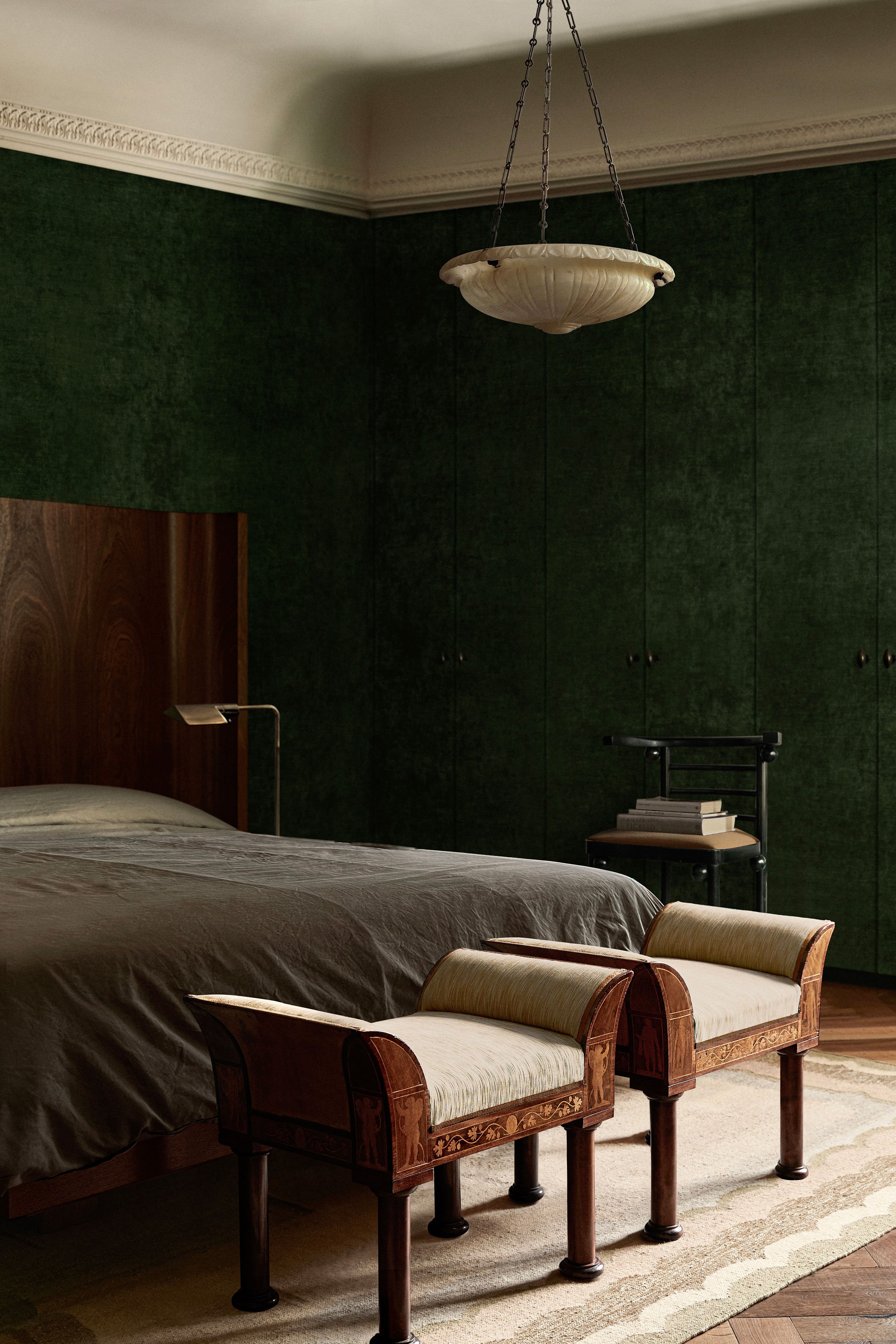 Bed, Wall panelling &amp; rug: Custom design by Child Studio. Antique 1970s floor lamp designed by Cedric Hartman. Neoclassical pendant lamp from the 1900s. Antique Fledermaus Chair designed by Josef Hoffman, produced in Austria in 1900s. Antique early 19th century Empire stools, Denmark 1810s.
Photography by Helen Cathcart.