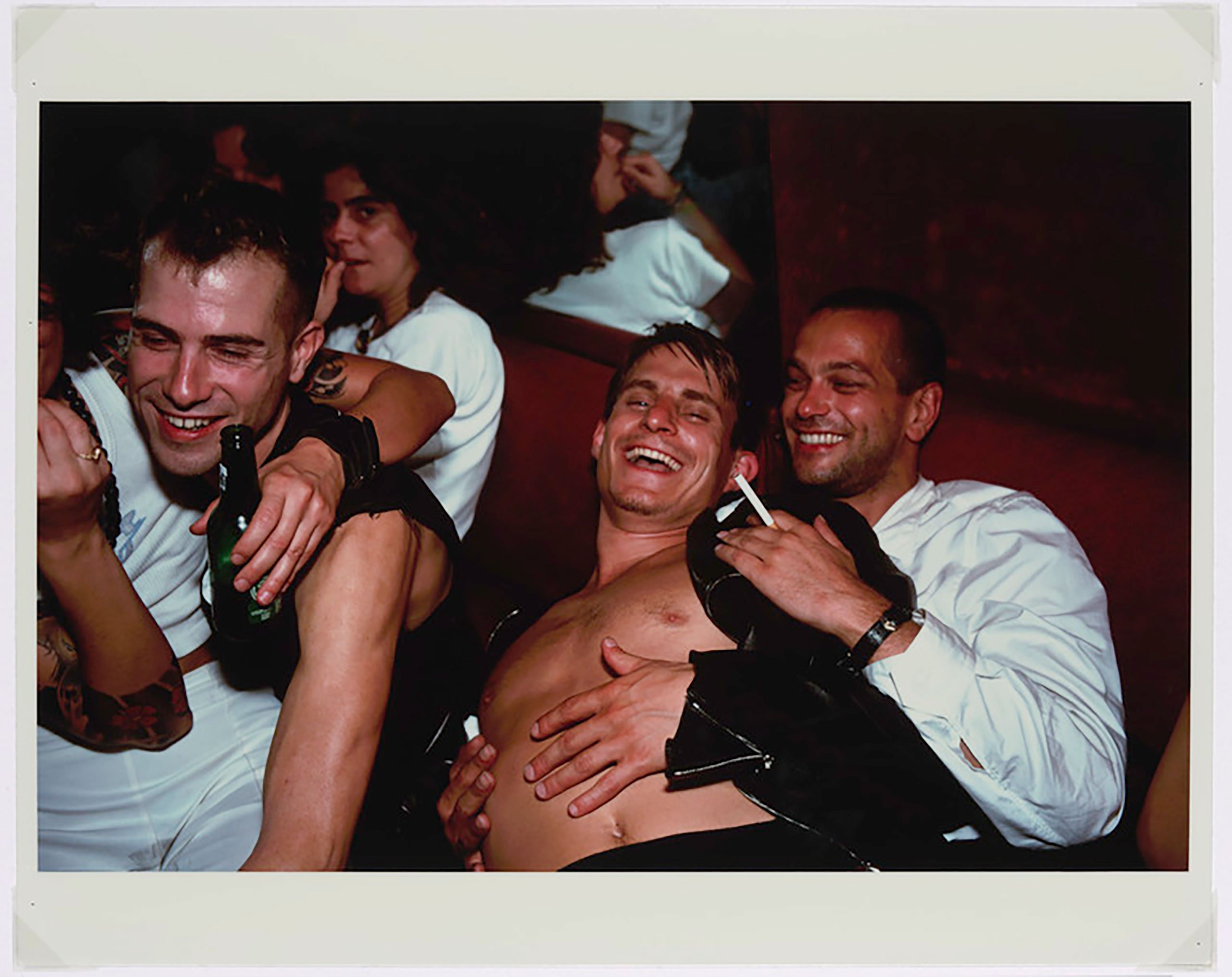 Nan Goldin, Clemens, Jens and Nicolas Laughing at Le Pulp, Paris, 1999.
© Nan Goldin. Courtesy of Nan Goldin and Gagosian.