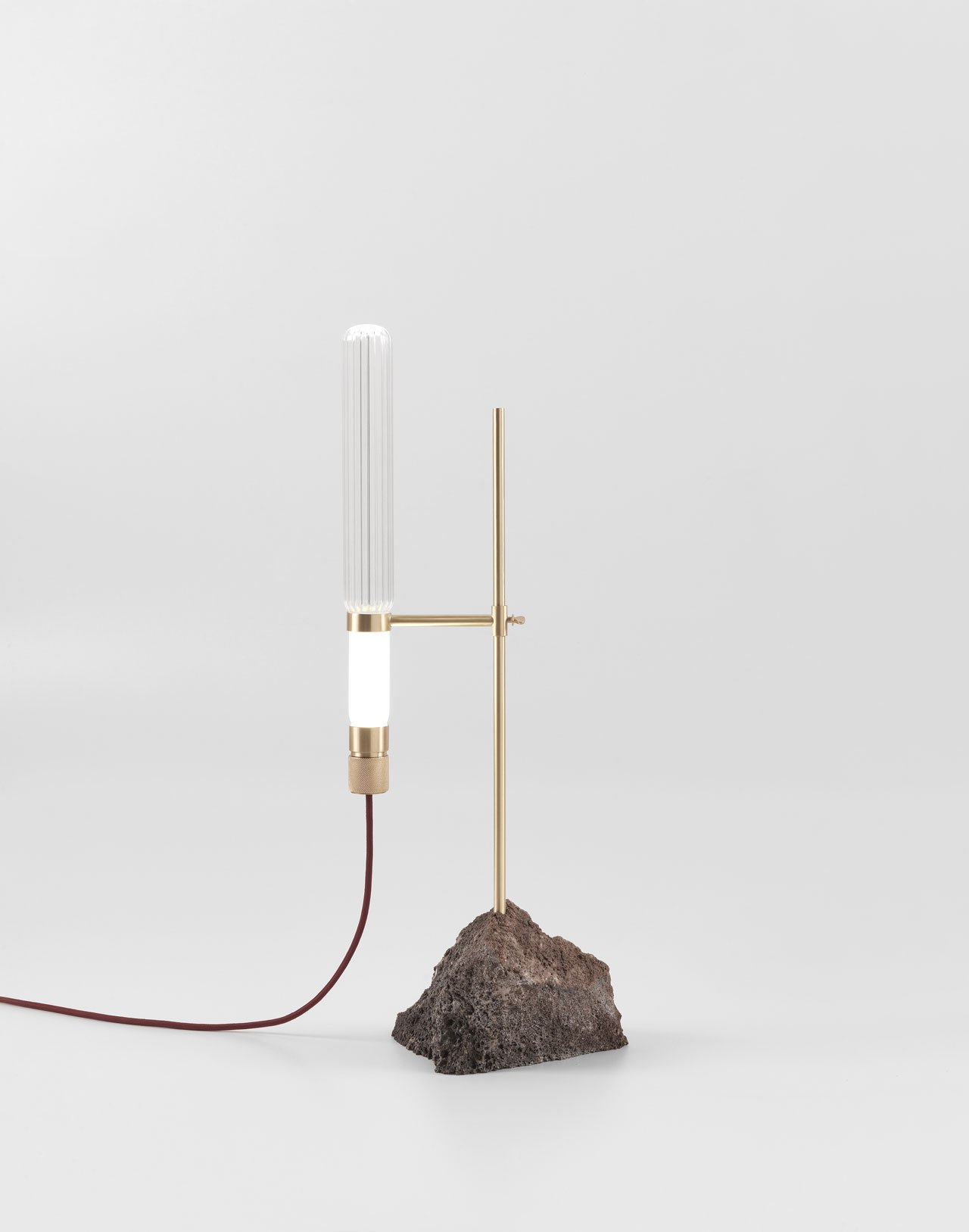 KRYPTAL table lamp by CTRLZAK for JCP Universe.Materials: lava stone base with matte brass structure and glass body.Dimensions (H x W x D): 75cm x 33cm x 15cm.Photo by Silvio Macchi © JCP Universe.