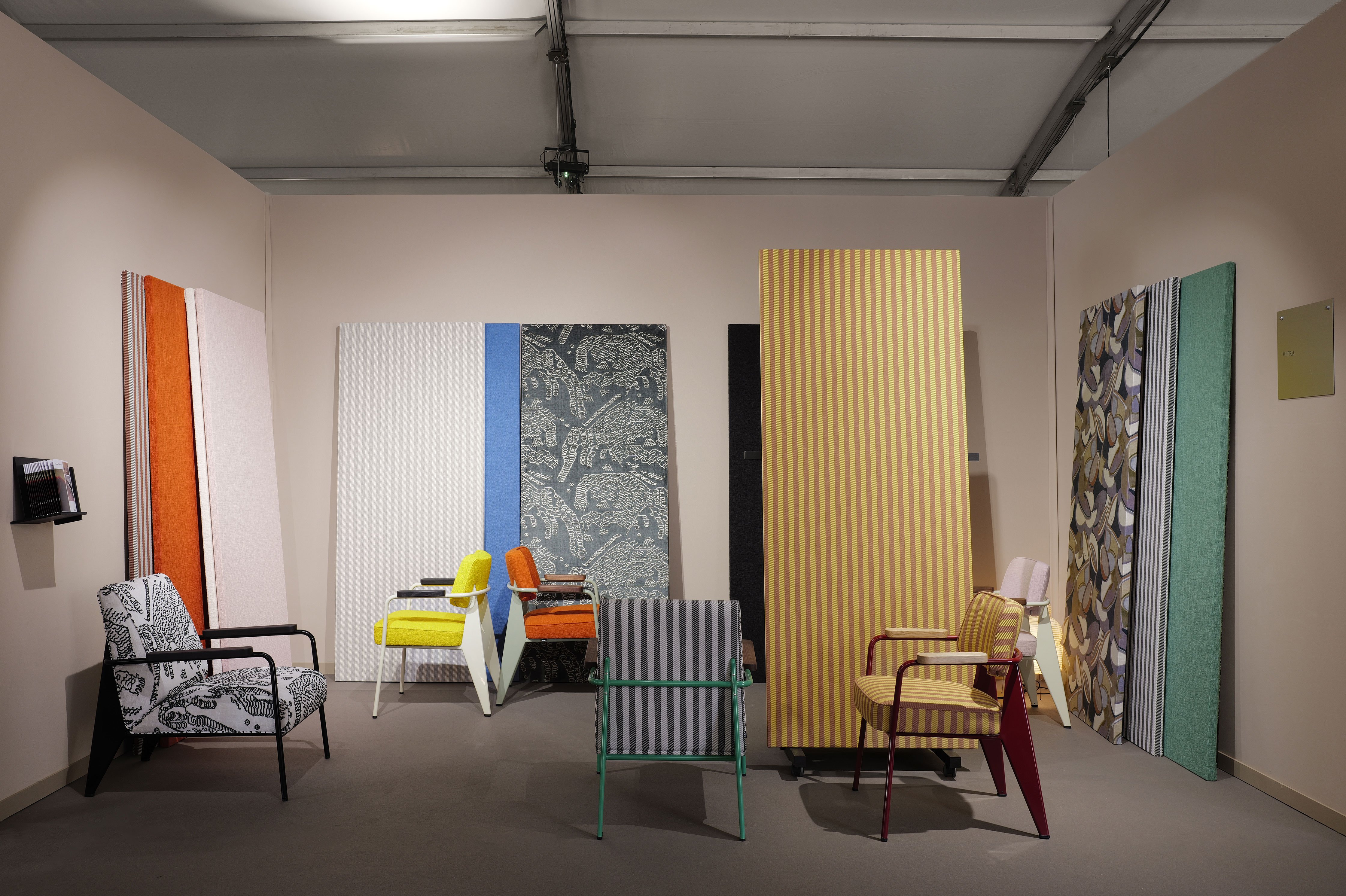 VITRA's stand was curated by French designer Julie Richoz and featured classics pieces by Jean Prouvé upholstered in new textiles by Dedar Milano. Photography by Tom Dagnas.