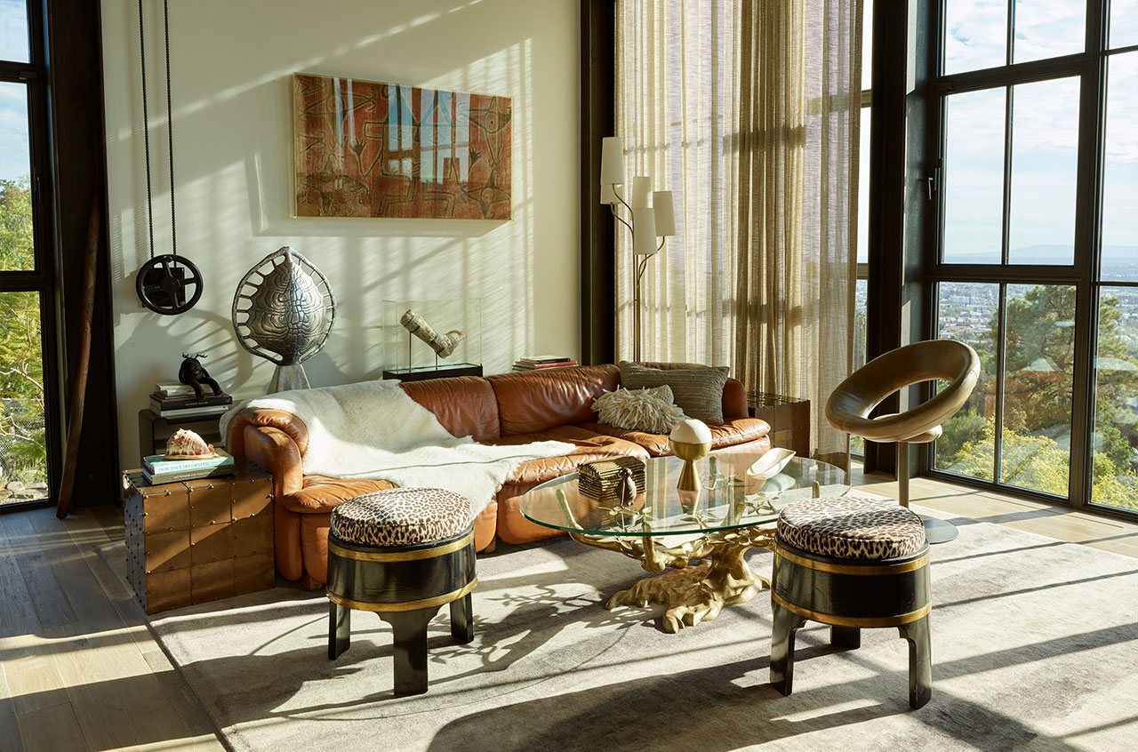 Hollywood Hills House by Mutuus Studio in Los Angeles, California.Photography by Kevin Scott.
Featured: Willy Daro bronze table with custom glass top, sofa by Alberto Rosselli for Saporiti, Anel chair by Ricardo Fasanello, polished aluminum Tortoise shell lamp by Arthur Court, Brian Henson's cast with Jim Hensons cartoons, Aboriginal tapestry (on the wall).