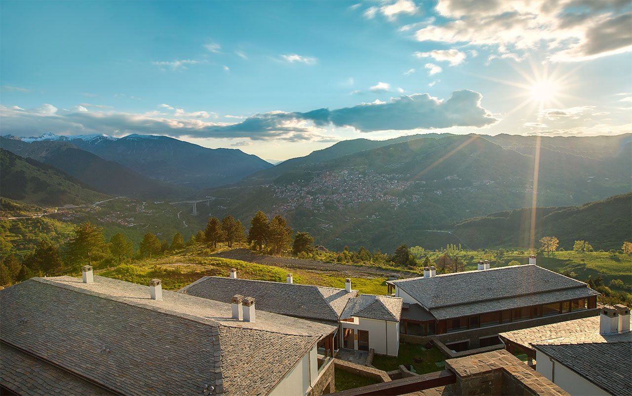 Expansive views of the mountainous landscape with Metsovo village looming large. © Grand Forest Metsovo | Metsovo, Greece.Photo by Christos Drazos.