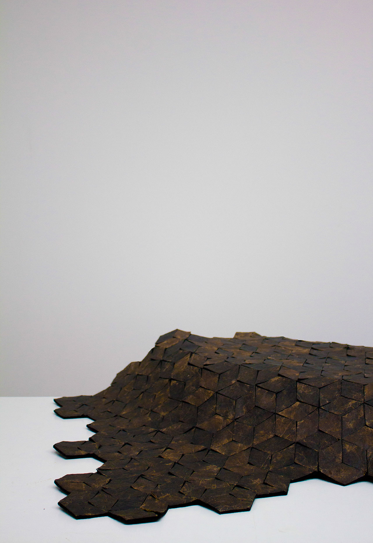 Marlène Huissoud, From Insects, Silk rug. Hundred of lozenges made out of the ‘Wooden Leather‘, assembled together to create a flexible surface. Photo by Yesenia Tibault Picazo.