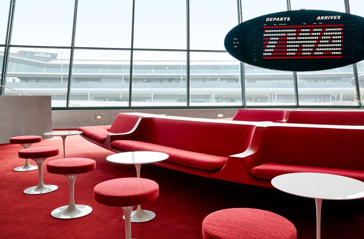 The Sunken Lounge at the TWA Hotel features Chili Pepper Red carpet and authentic penny tile.
Courtesy of TWA Hotel. Photo by David Mitchell.