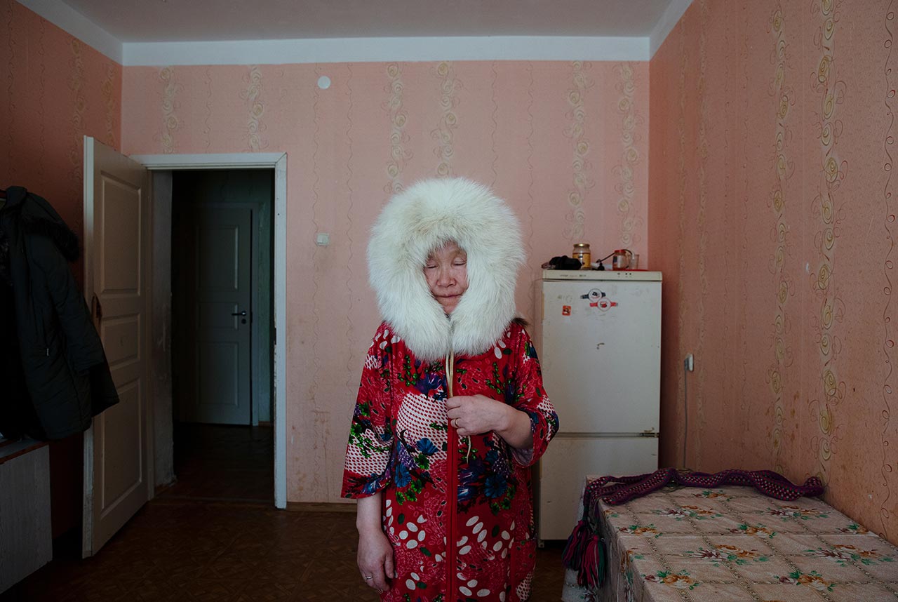 Pudani Audi (born.1948). Yar-Sale, Yamalo-Nenets Autonomous Okrug, Russia. Pudani was born in the tundra and roamed since birth. In this portrait, she is wearing a fur hat, the sole object she was left with from her wandering days.
Photo © Oded Wagenstein.