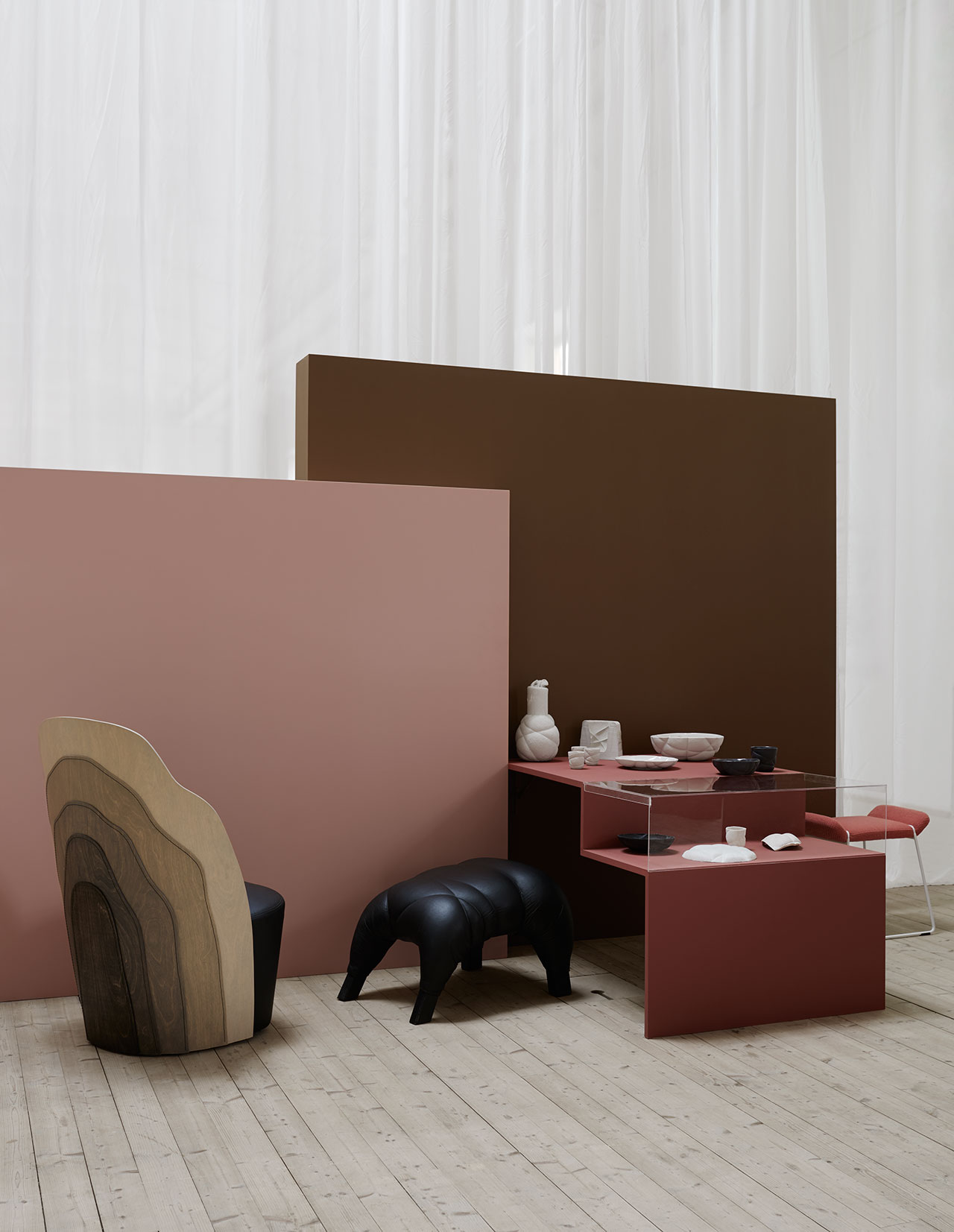 From left, armchair Julius, design Färg &amp; Blanche for Gärsnäs. Video from production at Gärsnäs. Armchair Couture, design Färg &amp; Blanche for BD Barcelona. Stool Succession, Färg &amp; Blanche. Ceramic Succession Ceramic for Petite Friture 2016. On the podium, form for the production of the carafe in felt, the first mold in plaster. Under the glass case, material for the formation of Succession Ceramics. Stool Frankie, design Färg &amp; Blanche for Johanson Design. Photo by Kristofer Johnsson.