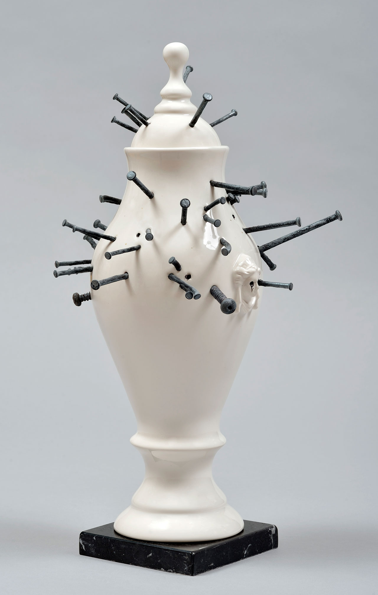 Craste Laurent, Vase Vaudou, 2014. Porcelain, glaze, nails, marble. 41.8 x 21.4 x 22.8 cm.